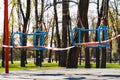 Restriction tape on children swings during state of emergency due to COVID