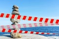 Restrictive tape. Stacked Rocks balancing, stacking with precision. Royalty Free Stock Photo