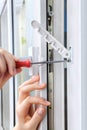 Restrictor is placed on double hung window to restrict expansion. Royalty Free Stock Photo