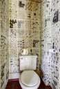 Restroom interior design. News paper all over the wall