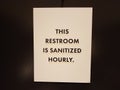 restroom is santized hourly sign on bathroom door