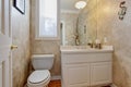 Restroom with white vanity cabinet Royalty Free Stock Photo