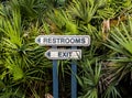 Restrooms and Exit Arrow Sign at a Public Park