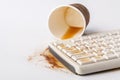 Result of eating in office, Coffee and damaged computer keyboard close up Royalty Free Stock Photo