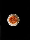 The result of pulverizing chili sauce in a white plastic container Royalty Free Stock Photo