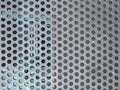 288 / 5.000Resultados de traducciÃÂ³nMetal panel background with holes. Perforated aluminum sheet metal. Full frame perforated