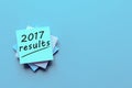 2017 results text on a blue workplace. The concept of achievements and failures of career and business at the Year