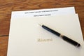 Resume folder with pen and employment history Royalty Free Stock Photo