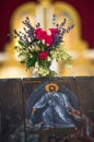 Resurrection of Christ Icon and a beautiful bouquet of flowers in a vase in a church Royalty Free Stock Photo