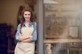 Retail, arms crossed and portrait of woman at restaurant, small business or waitress of coffee shop. Happy female Royalty Free Stock Photo