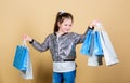 Retail. Holiday purchase saving. Cheerful child. Little girl with gift. Sales discounts. Fashion and style. customer Royalty Free Stock Photo