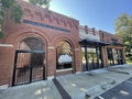 Retail strip mall small town Old brick building clear blue sky Royalty Free Stock Photo