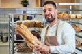 Retail trade concept , man owner of food factory using devices for online business order at bakehouse Royalty Free Stock Photo