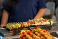 Retailer grilling BBQ skewer on Hot griller for customer Royalty Free Stock Photo