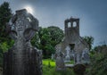 Small cemetery and ruined church tower. Celtic style gravestones with a sun star