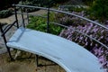 retaining seat wall made of pure cast concrete blooms purple Royalty Free Stock Photo