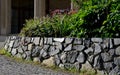 Retaining wall made of coarse basalt stones connected by cement. tunnel under the pedestrian road. the underpass is a historical r Royalty Free Stock Photo