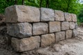 A retaining wall made of stone blocks. Royalty Free Stock Photo