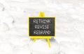 Rethink revise rebrand symbol. Concept word Rethink Revise Rebrand on beautiful blackboard. Beautiful white snow background.