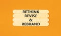 Rethink revise rebrand symbol. Concept word Rethink Revise and Rebrand on beautiful wooden stick. Beautiful orange background. Royalty Free Stock Photo