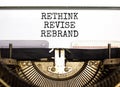 Rethink revise rebrand symbol. Concept word Rethink Revise Rebrand typed on retro typewriter. Beautiful white paper background.