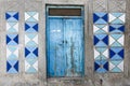 Rethymno, Island Crete, Greece, - June 23, 2016: Traditional Greek facade of house with blue wooden door and blue and white colore Royalty Free Stock Photo