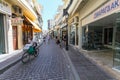 Rethymnon, Island Crete, Greece, - June 23, 2016: A deliveryman of pizza on the bicycle is on the narrow street of Rethymnon part