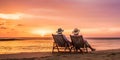 A retired couple enjoying a sunset on a beach, symbolizing peace and relaxation in retirement, concept of Tranquility Royalty Free Stock Photo