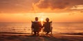 A retired couple enjoying a sunset on a beach, symbolizing peace and relaxation in retirement, concept of Tranquility Royalty Free Stock Photo