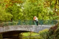 Retired couple hugging on bridge