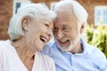 Retired Couple Sitting On Bench And Talking In Assisted Living Facility Royalty Free Stock Photo