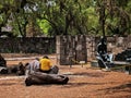 Retired couple sitting on a petrified tree trunk in Esculturas Park in Cuautitlan Izcalli city