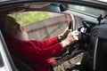Senior  man with long beard driving gray car Royalty Free Stock Photo
