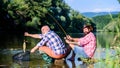 Retired father and mature bearded son. big game fishing. relax on nature. fly fish hobby of men. retirement fishery Royalty Free Stock Photo