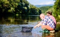 Retired father and mature bearded son. Two male friends fishing together. fly fish hobby of men. retirement fishery Royalty Free Stock Photo