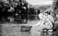 retired father and mature bearded son. Two male friends fishing together. fly fish hobby of men. retirement fishery Royalty Free Stock Photo