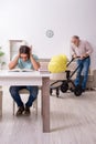 Retired grandfather looking after newborn at home