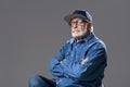 Retired high minded man resting on stool Royalty Free Stock Photo