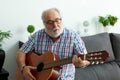 Retired man playing guitar Royalty Free Stock Photo