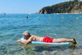 Retired man playing in sea water Royalty Free Stock Photo