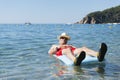 Retired man playing in sea water