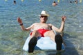 Retired man playing in sea water Royalty Free Stock Photo