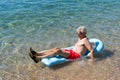 Retired man playing in sea water Royalty Free Stock Photo