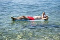 Retired man playing in sea water Royalty Free Stock Photo