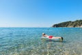 Retired man playing in sea water Royalty Free Stock Photo