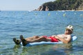 Retired man playing in sea water Royalty Free Stock Photo