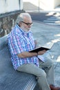 Retired man reading a book Royalty Free Stock Photo