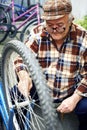 Retired man serviced bikes Royalty Free Stock Photo