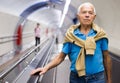 Retired man walking down the escalator to metro station Royalty Free Stock Photo