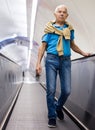 Retired man walking down the escalator to metro station Royalty Free Stock Photo